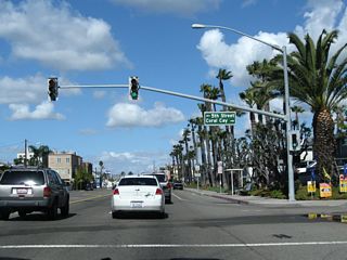 In Sunset Beach, northbound California 1 (Pacific Coast Highway) approaches Fifth Street  and Coral Cay Lane . Turn right for Huntington Harbor.