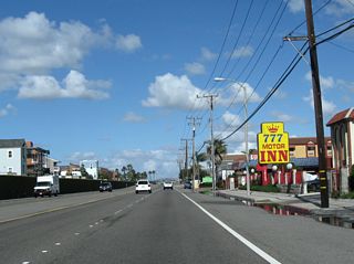 California 1 (Pacific Coast Highway) proceeds north into Surfside.