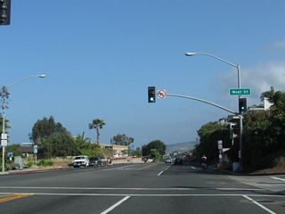Northbound California 1 (Coast Highway) meets West Street at this traffic signal.