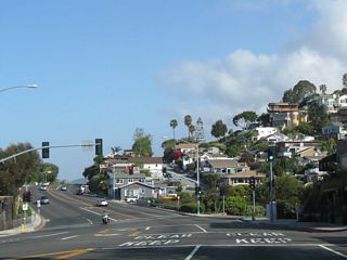 Houses and residential development lines the hillsides by the intersection with Nyes Place.