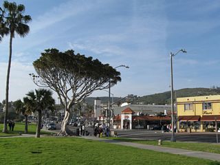 This view looks north from the main beach in Laguna Beach at the intersection joining California 1 (Coast Highway) and Ocean Avenue.