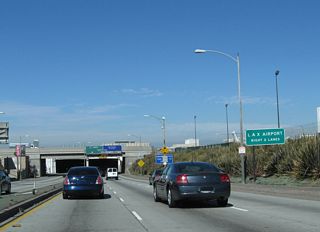 California 1 goes below grade through the Sepulveda Tunnel leading to ramps for the passenger terminal.