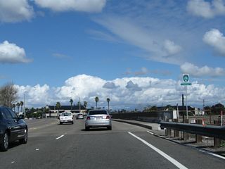 Long Beach employes a unique marker for its bicycle route system. Long Beach Bike Route 85 travels north along the San Gabriel River bike path.