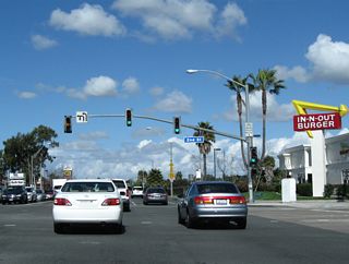 Northbound California 1 meets Second Street, which travels east to connect to Studebaker Road north.