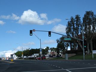 Northbound California 1 meets Channel Drive. The next turnoff connects California 1 north to California 22 east to Garden Grove.