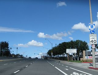 A truck regulation sign is the only indication that California 1 north is approaching California 22. Forthcoming Bellflower Boulevard provides a cutoff to California 22 east.