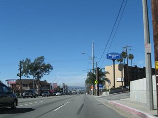 Reservoir Drive angles northwest from SR 1 northbound as a cut off to Redondo Avenue. West from Reservoir Drive to a point ahead of Cherry Drive, SR 1 is the dividing line between the city of Long Beach to the south and the city of Signal Hill to the north. Signal Hill, an enclave which is entirely surrounded by the city of Long Beach, was incorporated on April 22, 1924, and had a population of 9,333 as of the 2000 Census.
