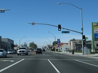 California 1 (Pacific Coast Highway) proceeds west from the intersection with Orange Avenue and Alamitos Avenue in Long Beach to Lemon Avenue.