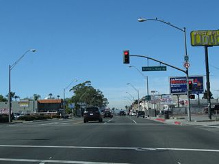 California 1 (Pacific Coast Highway) intersects Martin Luther King, Jr. Avenue next to Long Beach Polytechnic High School.