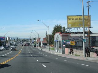 A bike route sign is posted rather than a California 1 route marker after Long Beach Boulevard.