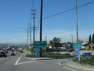 A loop ramp connects California 1 north with Interstate 710 south to the Port of Long Beach, Queen Mary, and Downtown Long Beach.