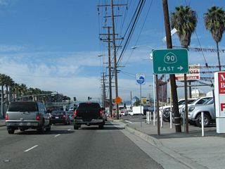 Leaving the Tsunami Hazard Zone, northbound California 1 intersects California 90 (Marina Expressway). California 90 is a short expressway-freeway combination that connects Lincoln Boulevard, I-405 and Slauson Avenue. Once a planned east-west freeway that would follow Slauson Avenue and connect to Imperial Highway, only the short section near California 1 and Interstate 405 was built. The rest remained a legal definition for a future freeway that was unlikely to ever be built.
