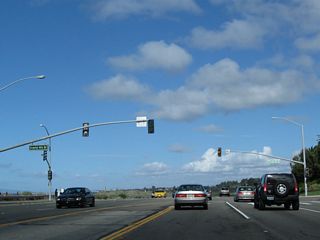 Once in the city of Newport Beach, residential development lines the northeast side of the coastal highway, while the state park and protected beach is on the southwest side of the highway. California 1 continues in a northwesterly direction.
