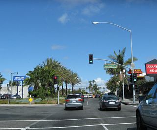 In the center of Corona del Mar (Newport Beach), northbound California 1 meets Marguerite Avenue northeast to San Joaquin Hills Road.