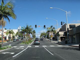 Northbound California 1 (Coast Highway) meets Iris Avenue.