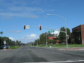 The next intersection along California 1 (Coast Highway) north is with Avocado Avenue. The state route will soon leave Corona del Mar and enter Newport Center.