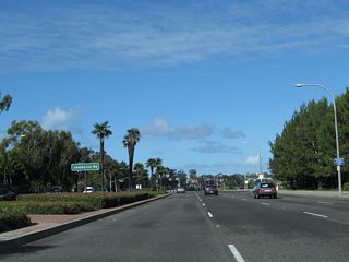 Continuing northwest (almost due west), California 1 (Coast Highway) next approaches Jamboree Road, a major southwest-northeast arterial that extends from Newport Beach northeast to Irvine and Tustin before merging directly onto the California 261 toll road.