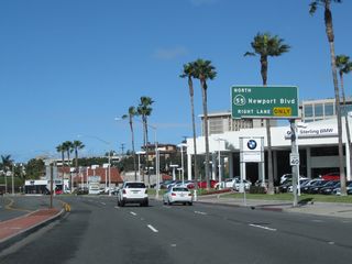 Nearing Mile 20, northbound California 1 (Coast Highway) approaches its interchange with California 55 (Newport Boulevard). Through this interchange, California 1 travels almost due west, and California 55 leaves the interchange almost due north. California 55 is a major north-south Orange County corridor, leaving Newport Beach and traveling into Costa Mesa, then proceeding north toward Santa Ana and Anaheim before ending at California 91 (Riverside Freeway). Most of the route is a freeway, excluding the section in Newport Beach and part of Costa Mesa.