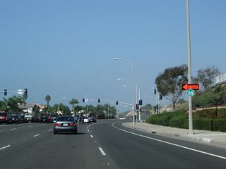 An oddly-shaped, neutered California 55 Detour trailblazer is posted prior to Balboa Boulevard. Take Balboa Boulevard south to downtown Newport Beach and to an alternate route to California 55 (Newport Boulevard).
