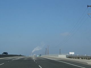 California 1 (Coast Highway) crosses over the Santa Ana River. The highway then leaves the city of Newport Beach and enters the city of Huntington Beach.
