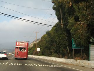 This partially obscured sign reads, "Beach Parking, one-half mile."