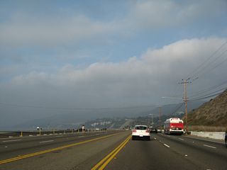 The Santa Monica Mountains rise prominently along the northern horizon along California 1 (Pacific Coast Highway).