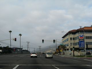 Northbound California 1 (Pacific Coast Highway) meets Sunset Boulevard at this traffic signal. A very long, winding arterial route, Sunset Boulevard generally travels east toward Hollywood and Downtown Los Angeles.