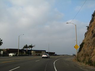 Continuing west toward Malibu, SR 1 circumvents this bluff at Topanga Beach.