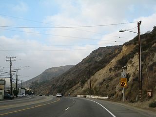 SR 1 continues west between Las Tunas Beach and Pena Canyon on the ensuing stretch west of Tuna Canyon.