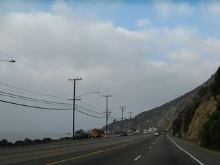 Pacific Coast Highway shifts southward ahead of Piedra Gorda Canyon and Big Rock Beach.