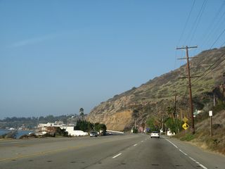 California 1 (Pacific Coast Highway) continues west by Solstice Canyon.