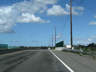 A grade separation takes SR 1 (Pacific Coast Highway) over Kitts Highway, which is part of Seal Beach Naval Weapons Station.