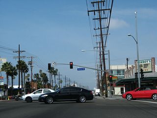 Northbound California 1 (Lincoln Boulevard) meets California 187 (Venice Boulevard) at this signalized intersection. To the west, Venice Boulevard is the most direct route to Venice Beach and Pacific Avenue, which is the closest arterial parallleing the beach and coastline. California 1 stays inland since there is no crossing over the Marina del Rey entrance channel, thus making Pacific Avenue a discontinuous arterial and unavailable for through traffic between Marina del Rey and Playa del Rey.