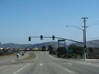 Around the intersection with Hancock Drive west to Allan Hancock College, California 1 enters the city of enters the city of Lompoc ("The City of Arts and Flowers"), with a population of 41,103 as of the 2000 Census. The city was settled in the mission era in 1787 and was incorporated in 1888. The city gained significant population through the late 1950s and 1960s with the development of Vandenberg Air Force Base, which brought military jobs to the region. The name of the city of "Lompoc" is derived from a Chumash (Native American) word "Lum Poc" that means "little lake" or "lagoon."