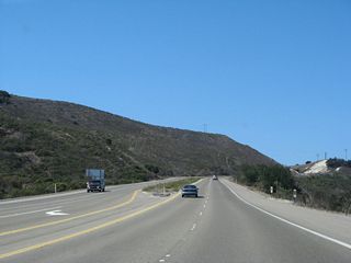 After splitting from California 135 and passing the intersection with San Antonio Road West, southbound California 1 (Cabrillo Highway) begins its ascent toward Vandenberg Space Force Base.