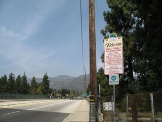 Prior to crossing Interstate 210, this sign advises of regulations for parking in La Canada Flintridge. Despite the "welcome" sign, Angeles Crest Highway begins in La Canada Flintridge and continues north through the city. Ahead (after the Interstate 210 underpass), California 2 continues northeast.