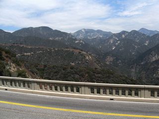 This view looks east from the Slide Canyon Bridge on California 2 toward the San Gabriel Mountains. Below the highway is the Arroyo Seco, which originates northeast of here and flows southwest toward Pasadena.