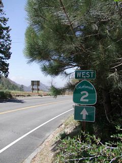 A California 2 west trailblazer is posted after the Mt. Wilson Red Box Road intersection in the shade of a conifer tree. Photos taken 05/21/10 by Martin Grahl.