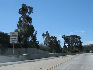 An end freeway sign is posted in the median for California 2 south.