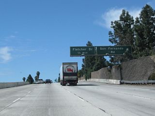 Southbound (westbound) California 2 (Glendale Freeway) meets Exit 14, Historic San Fernando Road (old U.S. 6-99) (former Business Loop I-5). U.S. 99 followed San Fernando Road until the Golden State Freeway opened in stages through the late 1950s and early 1960s. As the freeway opened, the old alignment on San Fernando Road was redesignated as U.S. 6-99 Business. When both U.S. 6 and U.S. 99 were eliminated in Los Angeles in the mid-1960s, the old alignment was renumbered as Business Loop I-5. The business designation was retired in the late 1980s as most know the historic route as San Fernando Road without any additional route number. The next exit along southbound California 2 is Exit 13B, Fletcher Drive.