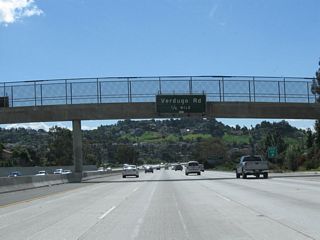 The next two off-ramps will be Exit 15A, Verdugo Road and Exit 14, Historic San Fernando Road (old U.S. 6-99) (former Business Loop I-5). This sign is posted on a pedestrian overcrossing next to the gore point for Exit 15B.