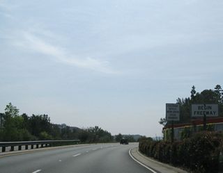 A begin freeway sign is posted after the freeway entrance shield assembly. California 2 will travel south over Interstate 210 and then join traffic from Interstate 210 en route to Glendale.