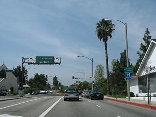 Now in La Canada Flintridge, eastbound Foothill Boulevard (former California 118) approaches Verdugo Boulevard, which served as California 2 until the Glendale Freeway was completed in stages through the 1970s. This overhead sign includes space for the California 2 route marker.