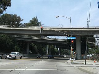 Soon thereafter, northbound Riverside Drive meets Allesandro Street. The California 2 freeway passes over Riverside Drive.