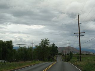 Green ranchland and farm fields line both sides of California 3 (Montague Road) on the drive east toward Montague.