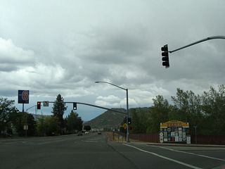 California 3 meets Business Loop I-5/Moonlit Oaks Road at this traffic signal. Ahead, California 3 shares pavement with both Business Loop I-5 and Historic U.S. 99; however, only the business route and historic route are signed through Yreka. California 3 is omitted from signage from Moonlit Oaks Road north to Montague Road at the north end of town. Officially, both Business Loop I-5 and California 3 follow Main Street through central Yreka. The city of Yreka is the seat of Siskiyou County. Yreka had a population of 7,765 as of the 2010 Census and was incorporated on April 21, 1857. Its motto is "Golden City."
