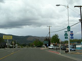 Business Loop I-5, Historic U.S. 99, and California 3 split at the point where North Main Street meets Montague Road. Business Loop I-5 and California 3 turn right onto eastbound Montague Road toward a junction with Interstate 5. California 263 and Historic U.S. 99 proceed ahead toward the Shasta River Canyon.
