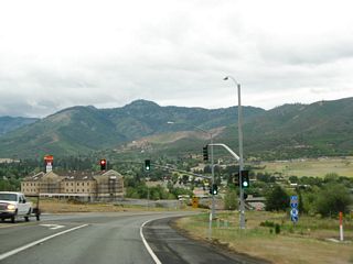 Westbound California 3 meets a traffic signal, which governs the flow of traffic into a nearby RV park. Ahead, California 3 approaches Interstate 5, the principal north-south freeway that passes through the state of California.