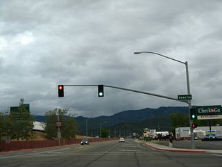 The next traffic signal along Business Loop I-5 and California 3 (Main Street) south is with Oberlin Street. At this point, Interstate 5 comes into view on the left. The business route and freeway will closely parallel each other for the next quarter mile.