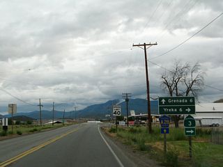 A short distance further south, the two routes divide: California 3 turns right along westbound Montague Road toward Yreka, while CR A-28 proceeds south toward Grenada. To Interstate 5 north, turn right. To Interstate 5 south, continue ahead.
